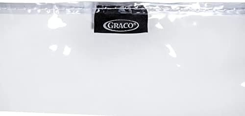 Parent wiping down the clear vinyl floor mat easily with a damp cloth after lunch