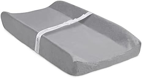 Delta Children diaper changing mattress showing the secure safety strap with quick release buckle.