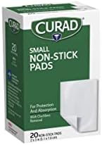 Back of Curad first aid non adherent pads packaging listing product features and material composition.