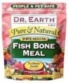 Dr. Earth 2.5 pound bag displayed next to gardening tools