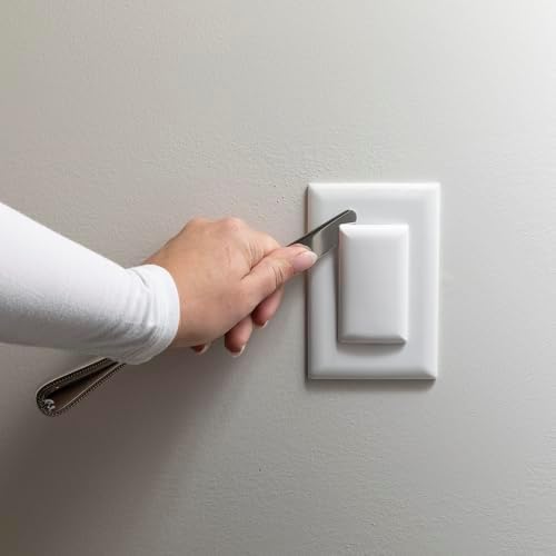 Minimalist white Qdos outlet cover on wall
