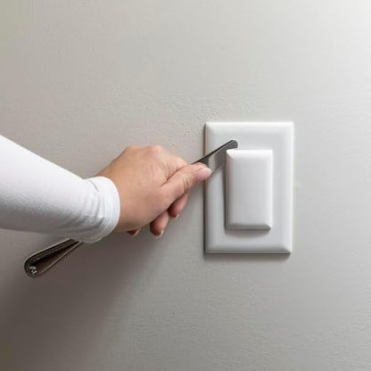 Minimalist white Qdos outlet cover on wall
