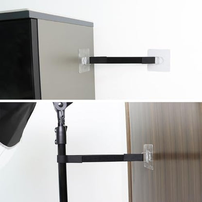 Secured flat screen display showcasing the anti tip protection system attached to a modern wooden console.