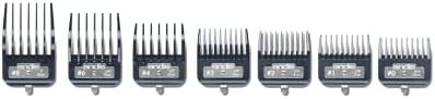 Professional barber using Andis metal attachment combs for fading
