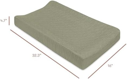 Babyletto matcha green changing pad cover showing the secure 360-degree elastic border