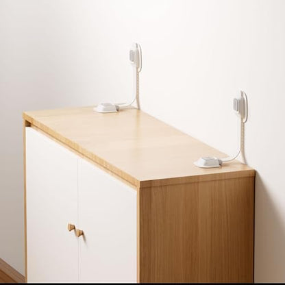 Close up of the heavy duty adjustable nylon strap connecting a dresser to the wall.