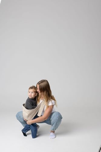 Side angle of the ergonomic hip carry support on the Monarch toddler carrier.