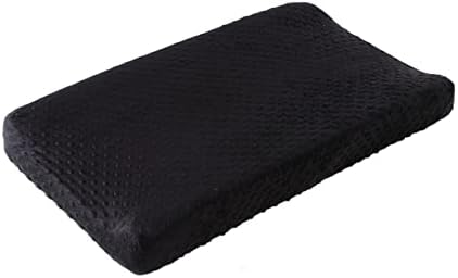 Gender-neutral black Queness Baby changing table cover displayed in a modern nursery room setting.