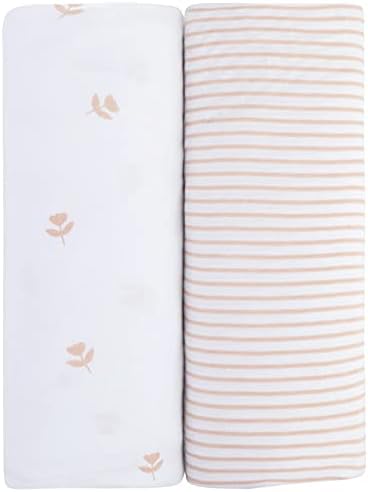 Soft and breathable Ely's & Co. pink tulip collection sheets stretched over a nursery changing pad.