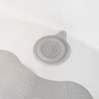 Ubbi drain cover packaging and product detail for authentic baby bath accessories