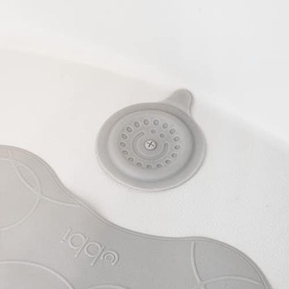 Ubbi drain cover packaging and product detail for authentic baby bath accessories