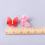 Small dog wearing Fzbnsrko butterfly hair bow grooming accessory