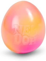 The Schylling Needoh egg being dipped into cold water to demonstrate the color transition.