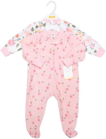 Infant wearing soft fleece Hudson Baby pajamas in cozy setting