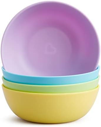 Full collection of Munchkin baby feeding supplies set on a dining surface