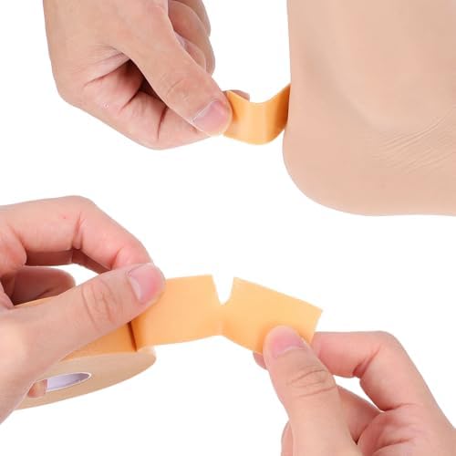 Trimming moleskin tape with scissors for customized foot protection.