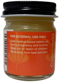 Organic calendula salve jar showing smooth texture for natural baby diaper rash care