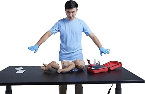 Bilingual AED training device showing voice prompt buttons and shock button.