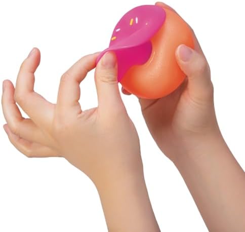 Schylling NeeDoh Dohnut toy with frosting detached demonstrating the switch and swap feature.