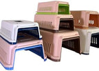 Portable medium dog carrier box optimized for road and air travel comfort.