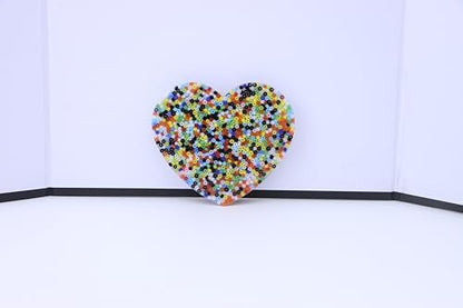 RadBizz Picky Pad sensory toy for trichotillomania relief being held in hand.