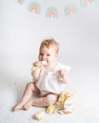 Side view of the Avanchy baby spoon showcasing the wide scoop and non toxic design.