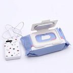 White infant wipe warmer on a changing table