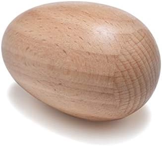 Child holding premium wooden egg shakers demonstrating proper grip for rhythmic play