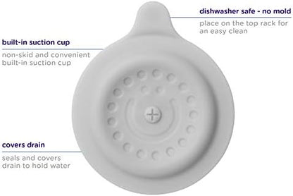 The Ubbi gray drain cover placed inside a baby bathtub