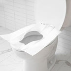 Oversized disposable restroom seat shield designed for adults and kids travel protection