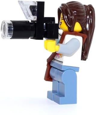 Collectible female wildlife photographer figure from set 60202 with detailed nougat jacket