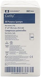 Four ply four by four inch rayon and polyester blend medical gauze sponges showing texture and thickness.