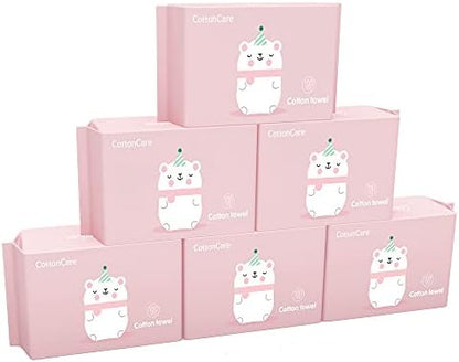 Infant face cleaning with Cottoncare hypoallergenic wipe