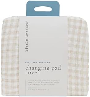 Side profile of the premium diaper changing sheet showing the snug elastic edges and safety strap holes.