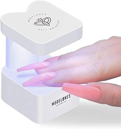 Modelones portable nail dryer showing USB power connection