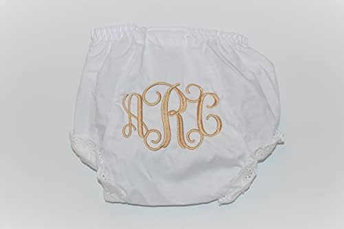 Close up of monogrammed baby diaper cover with lace trim details