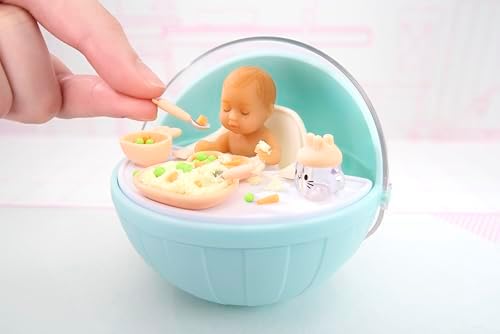 Replica mini baby food components including pretend applesauce and sliced avocado toy pieces.