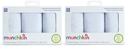 Machine washable Munchkin infant diaper changing pad liners being prepared for laundry cleaning