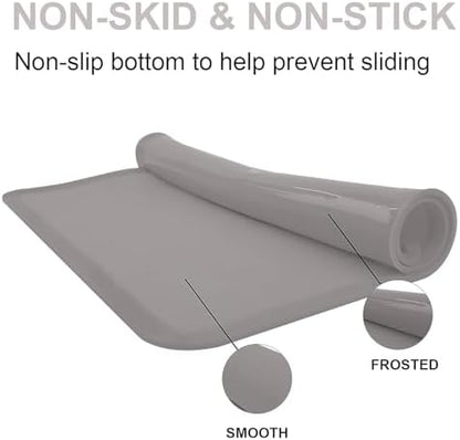 Waterproof food grade silicone placemat for children being cleaned in a kitchen sink