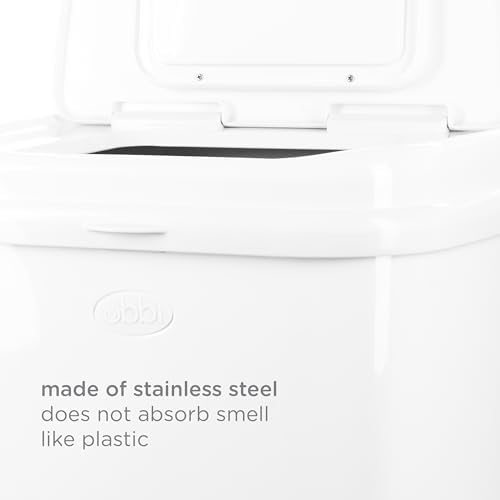 Ubbi odor locking stainless steel pail in a room setting