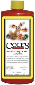 Cole's Flaming Squirrel Seed Sauce container shown alongside wild bird feed