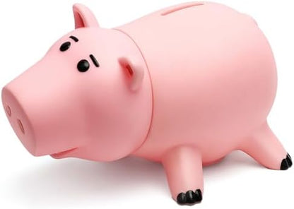 Side view of the unbreakable pink pig money bank displaying the coin slot on top.