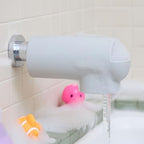 Close-up of the built-in bubble bath dispenser on the baby spout cover.