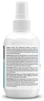 Vetericyn healing aid spray bottle next to packaging in pet first aid setup