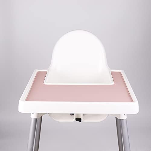 Pink food grade silicone feeding mat showing raised spill proof edges