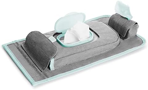 Munchkin portable changing pad showcasing the detachable wipes dispenser and bag storage compartment area.