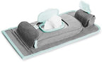 Munchkin portable changing pad showcasing the detachable wipes dispenser and bag storage compartment area.