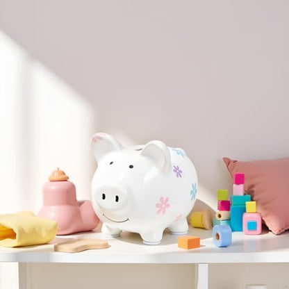 Kate and Milo mini floral money bank styled elegantly on a white wooden nursery shelf.