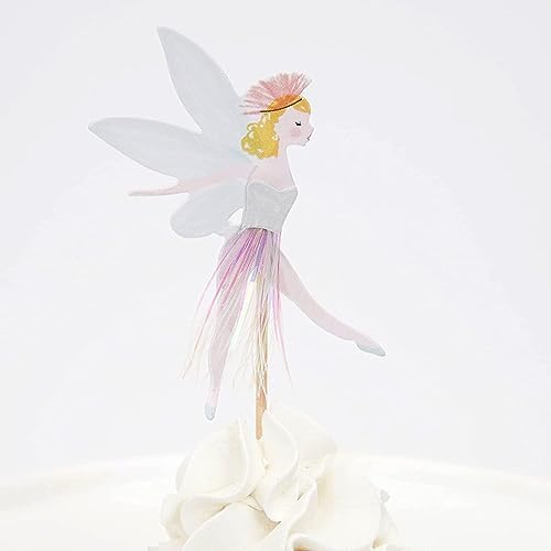 Decorative fairy toppers inserted in festive dessert
