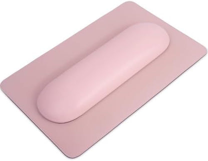 Nail tech using ergonomic pillow for hand support during manicure